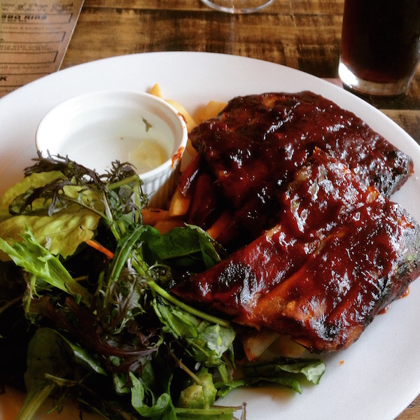 The Jack Daniels BBQ ribs pair with Leprechauns Belle Irish Red Ale at Deep Creek Brews and Eats - the best place for BBQ ribs and craft beer located in Browns Bay Auckland.